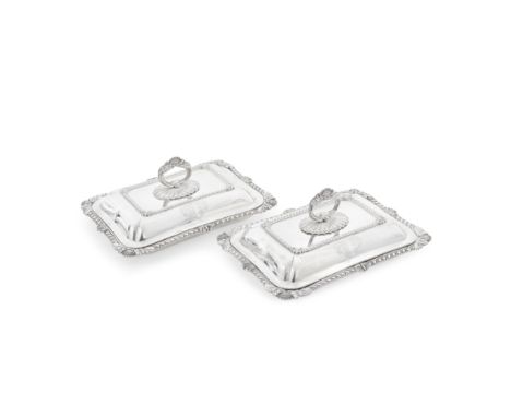 A pair of George IV silver entrée dishes and coversBenjamin Smith, London 1825 Each shaped-rectangular, the gadroon rim with 