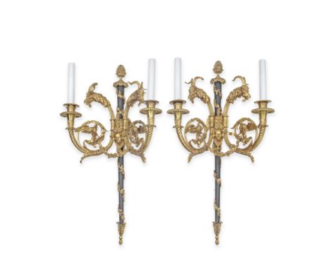 A pair of French gilt and black patinated bronze twin-light wall appliquesin the Louis XVI style, after the model by Pierre G