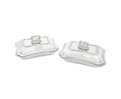 A pair of George IV silver entrée dishes and coversJoseph Craddock, London 1825 Shaped-rectangular form with gadroon rims, th