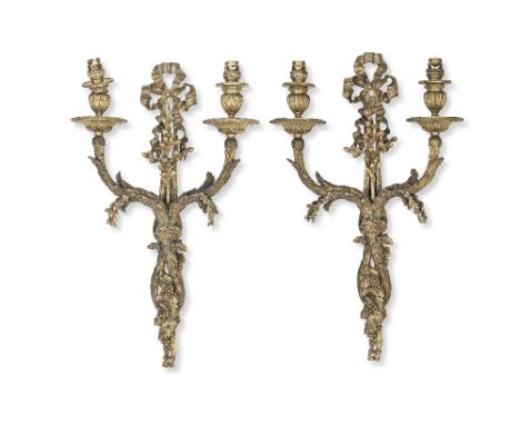 A pair of late 19th/early 20th century French gilt bronze twin-light wall appliquesin the Louis XVI stylethe elaborate reeded