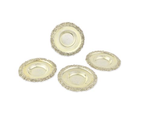 A set of four George IV silver-gilt butter / nut dishesRebecca Emes and Edward Barnard, London 1823 Each shaped-circular with