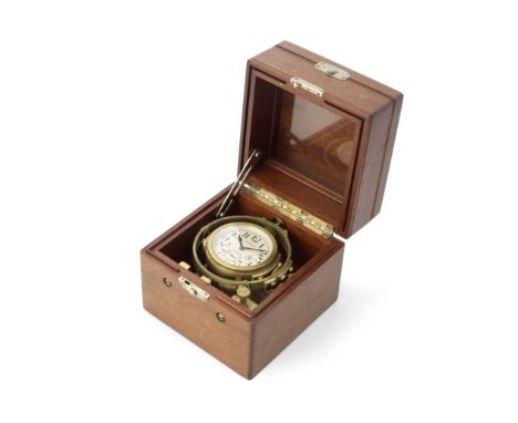 A mid 20th century American brass eight-day marine chronometerthe dial signed Waltham, the case numbered W97, the movement si