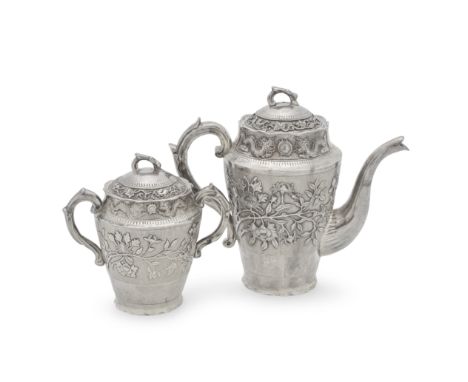 A Chinese Export silver coffee pot with matching twin-handled tea caddypossibly Hong Kong circa 1900 Of circular tapering for