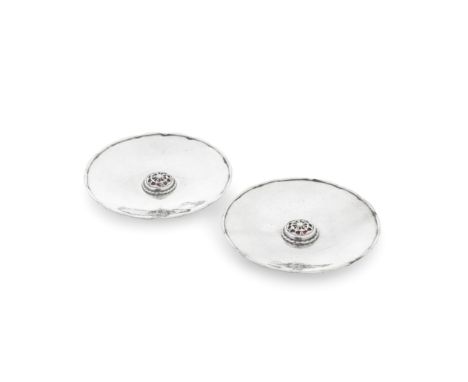 OMAR RAMSDEN: a pair of silver and enamel dishesLondon 1938Circular with shaped border, spot hammered surface, centred with a