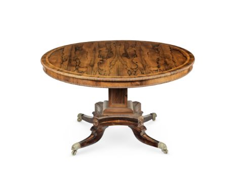 A Regency rosewood and tulipwood banded breakfast or centre tableCirca 1815, the circular tilt-top with a reeded edge above a