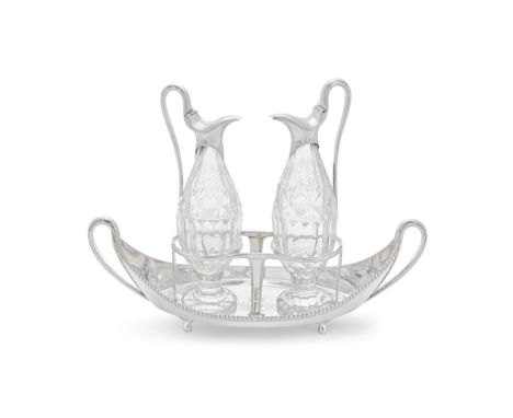 A George III silver two-bottle oil and vinegar cruet setJohn Touliet, London 1787Navette form with curved upswept sides and l