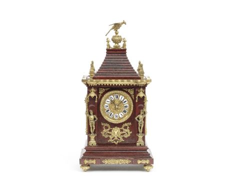 A late 19th century French gilt brass mounted and stained wood table clock with unique winding systemthe movement marked for 