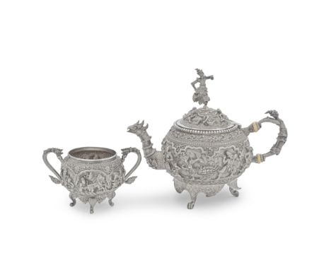 A Burmese silver teapot and twin-handled sugar bowlLower Burma (Myanmar) circa 1900 Of spherical form, the domed hinged cover