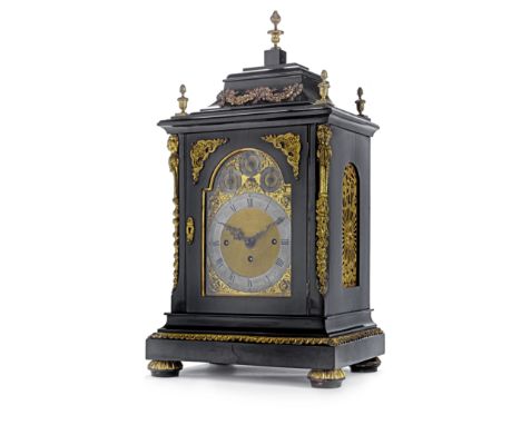 A late 19th century gilt brass and ebonised chiming bracket clockthe rectangular case with swept caddy top with ribbon-tied f