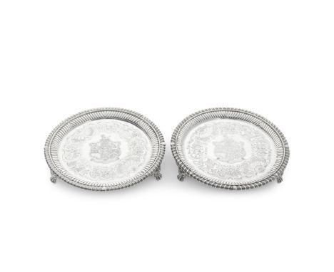 A George III and Victorian matched pair of silver waitersRichard Sibley I, London 1815 and Francis Boone Thomas, London 1874,