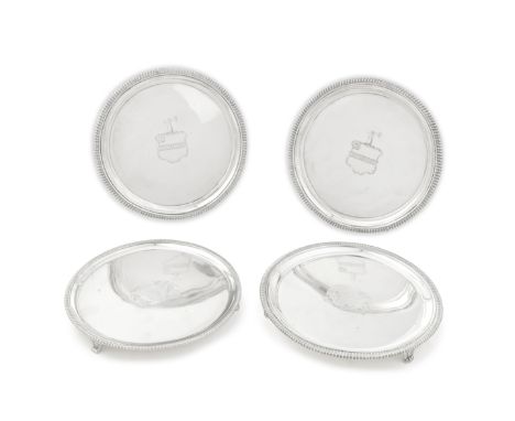 A small pair of George III silver salversThomas Hannam &amp; John Crouch, London 1806 Each circular with gadroon rim on brack