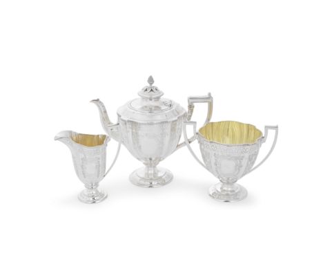 A Victorian silver matched three-piece tea serviceMartin, Hall &amp; Co, London 1874, cream jug Holland, Son &amp; Slater, Lo