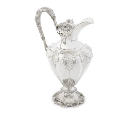 A William IV silver ewerCharles Reily &amp; George Storer, London 1835  Hinged cover over a waisted neck, with a naturalistic