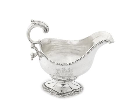 A George III silver sauceboatmaker's mark rubbed, London 1776 Oval bellied form with gadroon rim, engraved armorial to one si