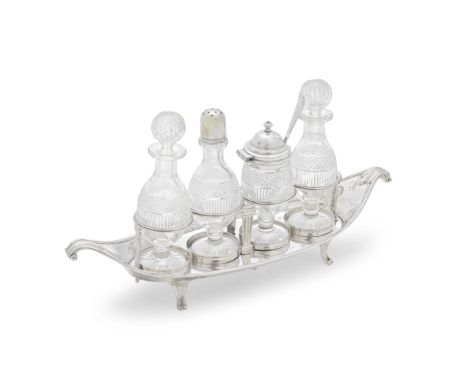 A George III silver condiment setRobert Hennell, London 1787 Elongated navette form with upswept scroll handles, on four scro