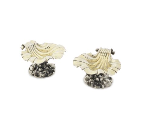 A good pair of George IV silver open saltsWilliam Eley II, London 1827 Each modelled as a sea shell with scroll handle, surfa