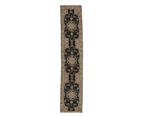 A charcoal Tabriz runnerc.1970, North West Persia,402cm x 78cm Footnotes:Please note that this lot is subject to the US embar
