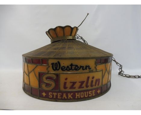 A 1950s style diner hanging light shade with fittings advertising Western Sizzling Steak House, 23" diameter.