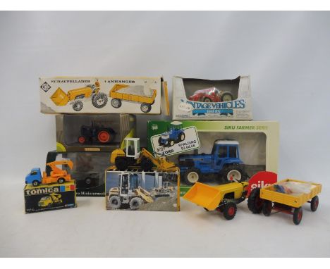 A selection of boxed agricultural tractors, different scales and models to include Siku, Tomica etc.