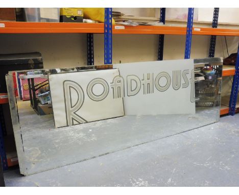 A large scale advertising mirror from The Roadhouse of Covent Garden, 70 x 32".