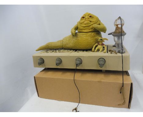 An original Star Wars Jabba The Hut on his plinth, with Salacious Crumb, complete with bong pipe, stand and restraining hook.