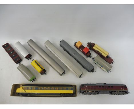 A Piko (?) USSR diesel, a Dutch railcar, three coaches and eight wagons by Fleischmann and others.