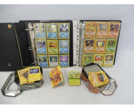 Pokemon - an extensive collection of cards in albums, including some rare first edition Holo back shinies, maychamp, charizar