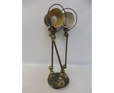 A superb original possibly circa 1930s Jielde French triple industrial bench light, with adjustable arms, approx. 30" when fu