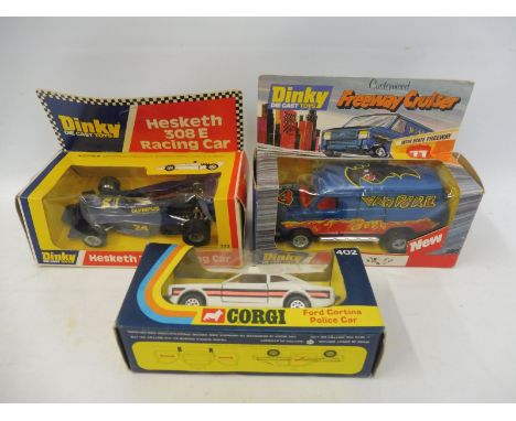 A boxed Dinky Toys Customised Freeway Cruiser no. 390, a boxed Dinnky Toys Hesketh 308 E Racing Car, no. 222 and a boxed Corg