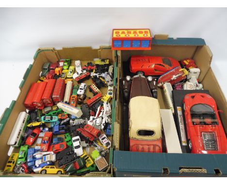 A tray of assorted playworn die-cast models of different scales.