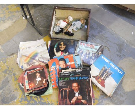 A selection of LPs including The Kinks, plus a partial puppet set.