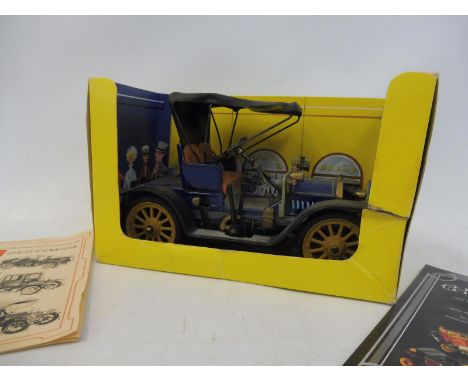 A Schuco 'Opel' tinplate clockwork car, no. 1228, with partial box and leaflet and key. 