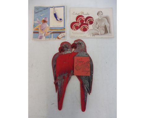 A Christmas 1927 'Compliments of the Season' die-cut greetings card in the form of two red felt covered parrots with a 1928 c