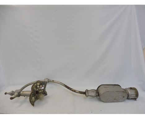 An Edwardian cast iron post mounted street lamp, with reflective shade.