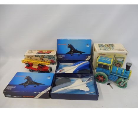 Two boxed Air France Concorde, plus two tinplate vehicles, one a road roller, the other a Hawkeye.