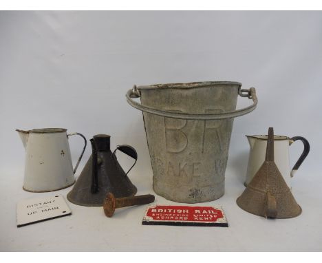 A British Rail brake bucket, two enamel jugs, an oiler, funnel, BR plaque etc.