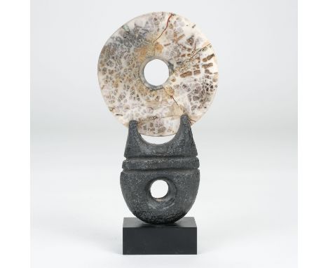 AR  * Hayes (Peter, 1946-). A fractured raku disc, 2011, mounted on a canal clay and slate base, etched signature and date, h