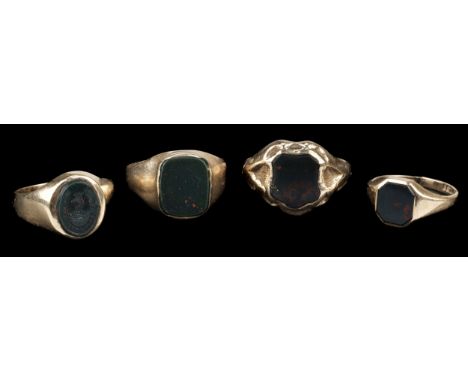 * Rings. A 9ct gold seal ring, inset with a bloodstone intaglio, carved with a family crest, stamped '375', size P/Q, togethe
