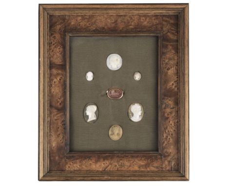 * Grand Tour. A yellow metal ring set with an oval carved carnelian stone, 18th century, the speckled stone depicting a recum