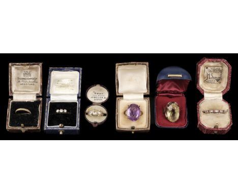 * Rings. A 9ct gold ring, the openwork mount set with a large facet-cut citrine, stamped ' 9 375', size O, period box, togeth
