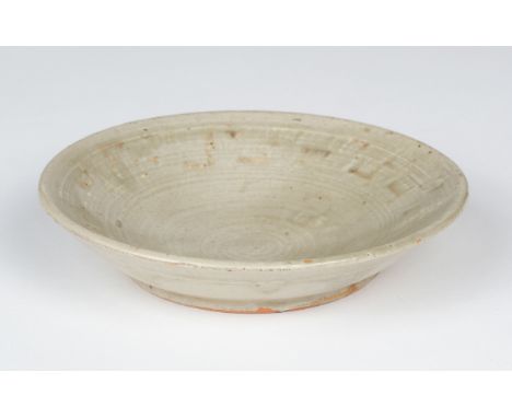 AR  * Leach (Bernard Howell, 1887-1979). An early stoneware dish, mid to late 1930s, covered in a celadon glaze, impressed ea