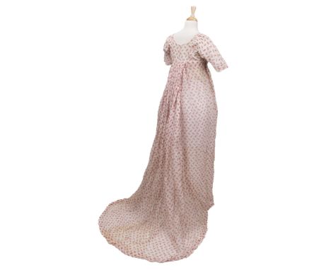 * Clothing. A Regency muslin dress, circa 1805, hand-stitched white muslin fall-front gown, with red printed pattern of styli