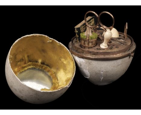 * Sewing. A duck egg sewing etui, French, circa 1818, the real duck eggshell case with yellow metal hinged mount, opening to 