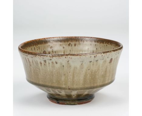 AR  * Dodd (Mike, 1943-). A stoneware footed bowl, covered in a green ash glaze, impressed MJD mark (partially flooded) to ba