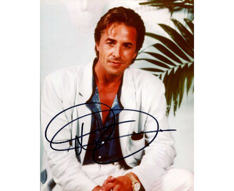 JOHNSON FAMILY: Don Johnson (1949- ) American actor. Signed colour 8 x 10 photograpoh of Johnson seated in a relaxed half-len