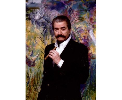 NEIMAN LEROY: (1921-2012) American artist. Signed colour 5 x 7 photograph of Neiman standing in a half-length pose holding a 