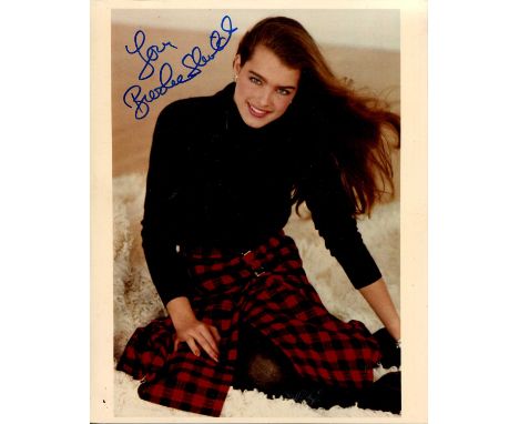 GLAMOUR: A good selection of signed colour 8 x 10 photographs by various film actresses and models comprising Brooke Shields,