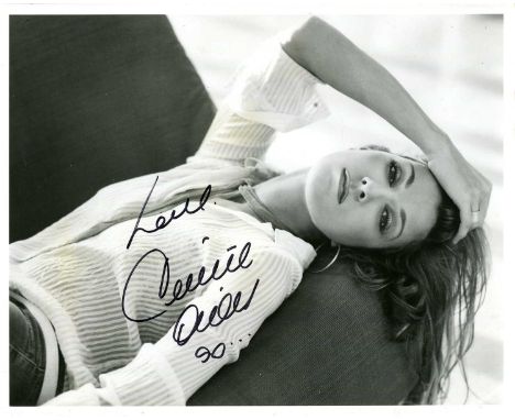 DION CELINE: (1968- ) Canadian singer. Signed 10 x 8 photograph of the singer reclining in a seductive half-length pose and w