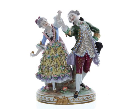 Sitzendorf porcelain figural group of a&nbsp;dancing&nbsp;couple,&nbsp;the lady holding a fan, a tree trunk behind, on an ova