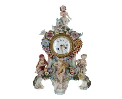 Attractive Sitzendorf porcelain mantel clock, the case with four putti figures representing the seasons, with floral encruste